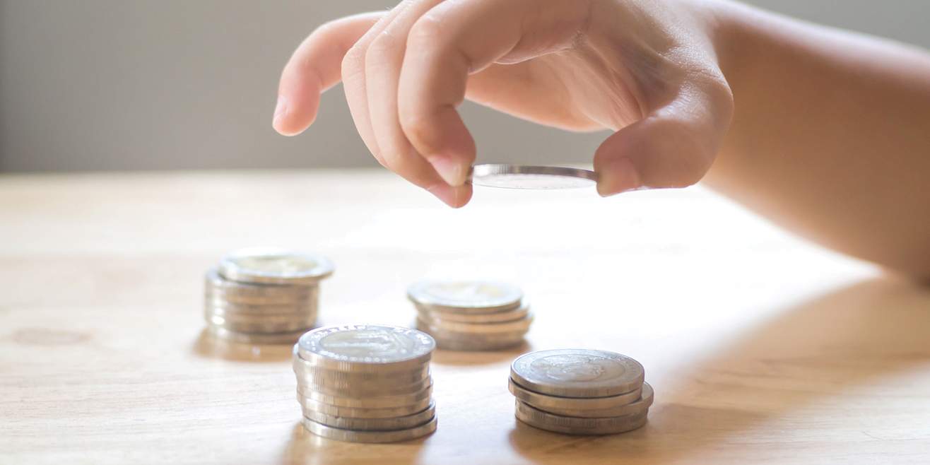 Child stacking coins